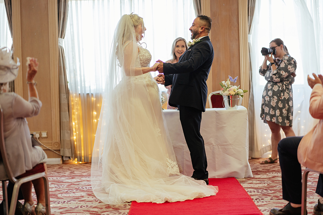 Bride jumps for joy when pronouced husband and wife at Marks Tey Hotel