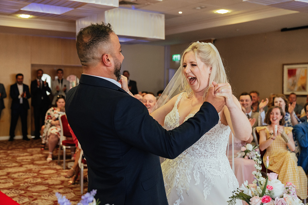 Bride jumps for joy when pronouced husband and wife at Marks Tey Hotel
