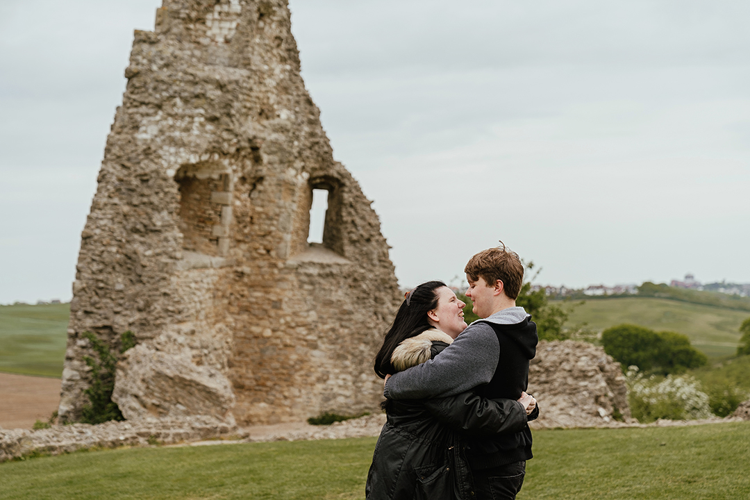 Castle remains in background couples photos at Hadleigh Castle
