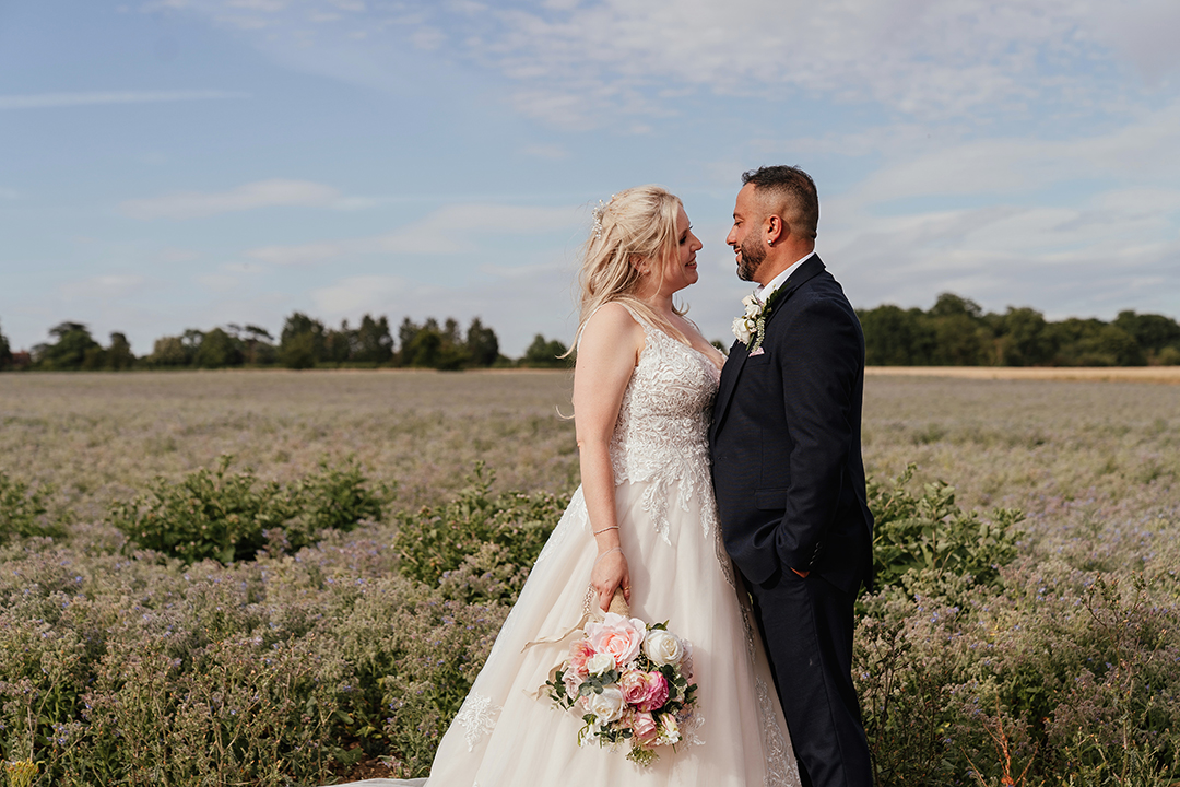Couple in Field with Blue sky Stock Street Farm Barn Wedding Photography