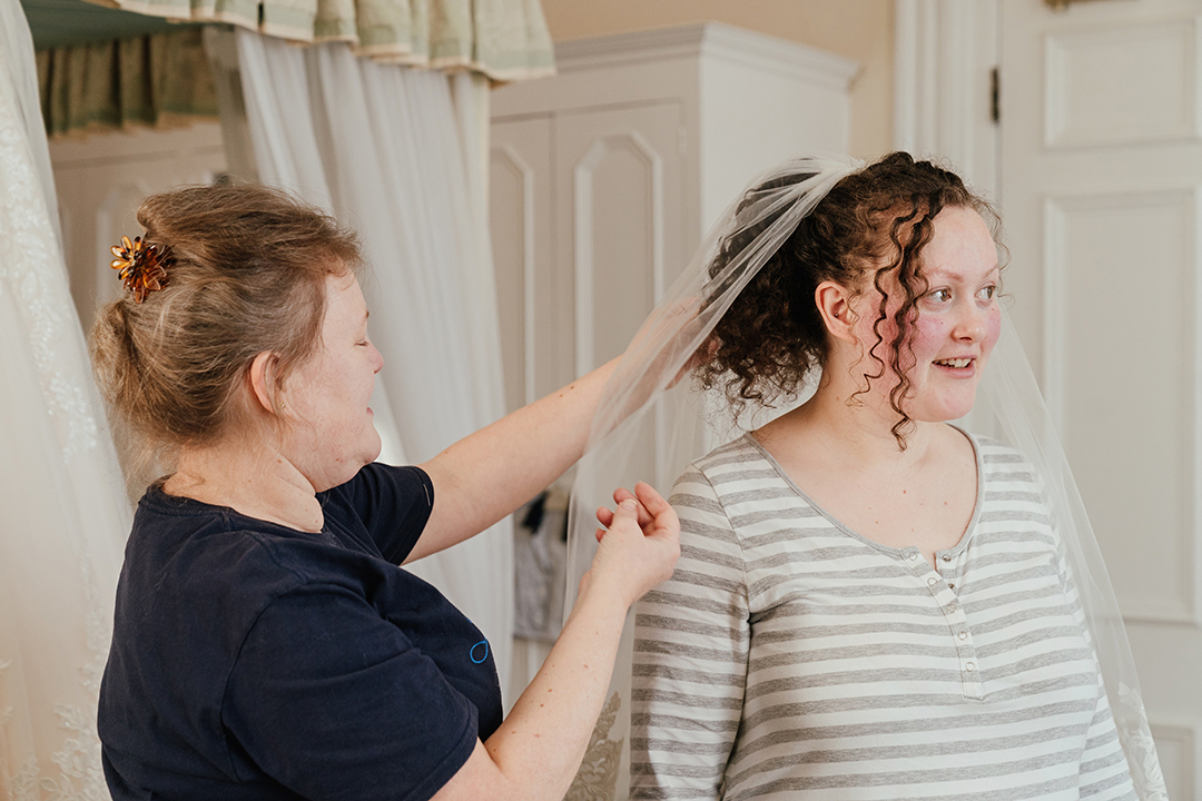 Mum Helps Bride with Veil Manor of Groves Wedding