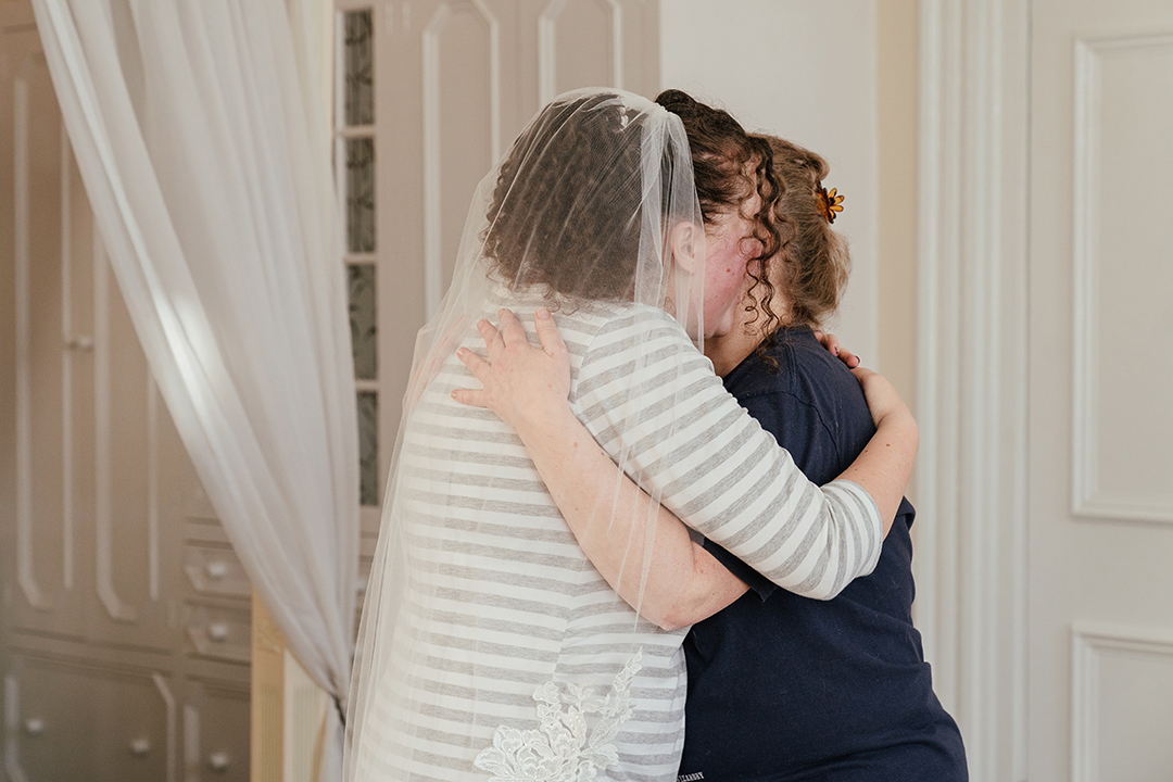 Bride and Mum Embrace Manor of Groves Wedding