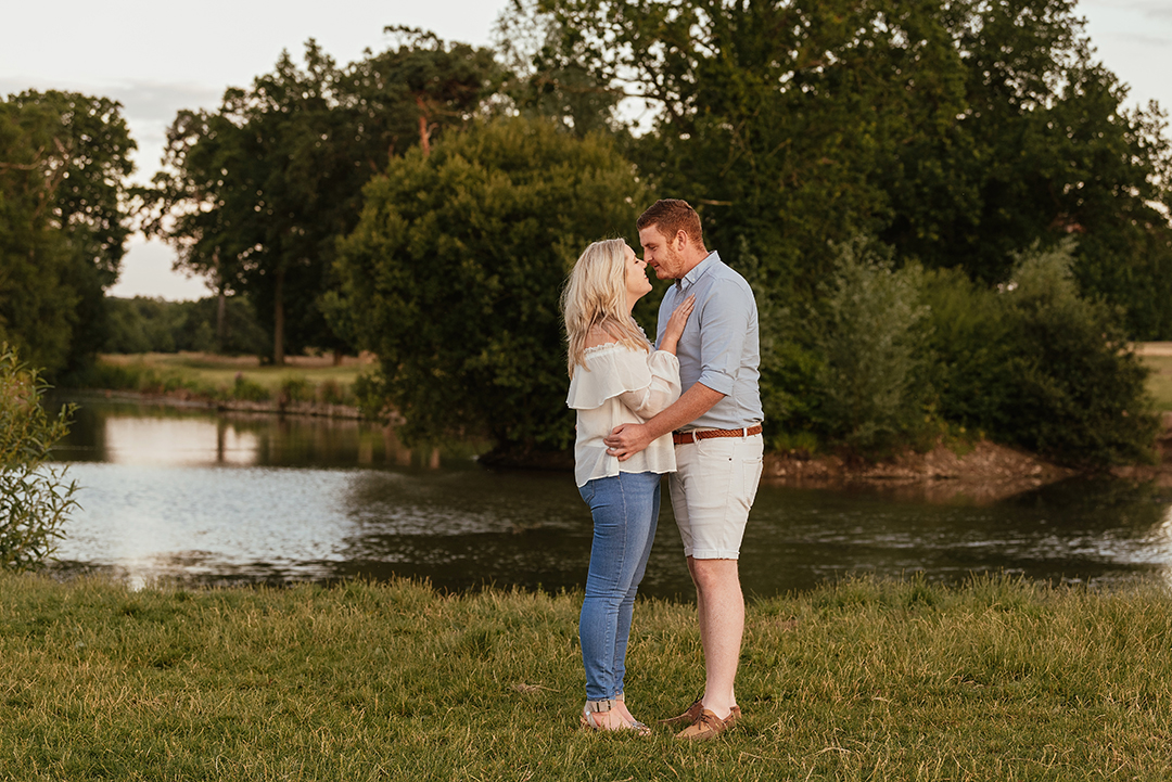 Full length of couple embracing, lake in background Hylands park engagement session