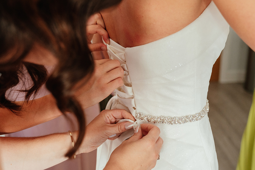 Close Up of Dress Being Done Up St Albans Registry Wedding