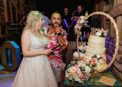 085 Wedding Moments 2022 - Cake Cutting Stock Street Farm Barn Wedding Photography