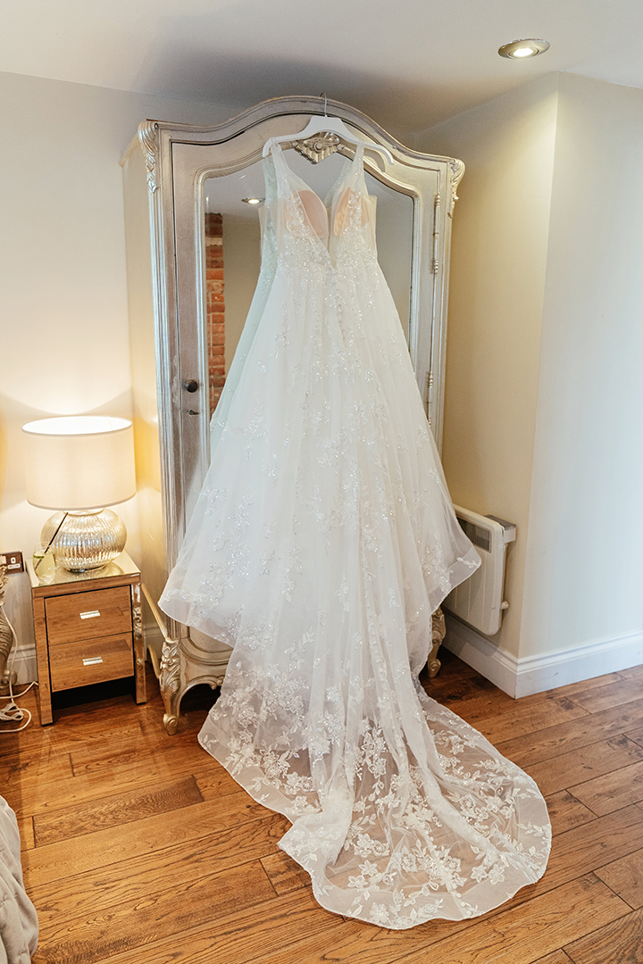 Vaulty Manor Wedding Photography Wedding Gown Hanging on Wardrobe
