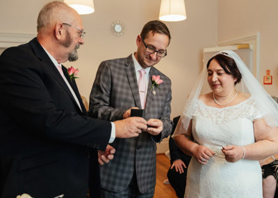 Best man give bride ring at Moot House Wedding Ceremony
