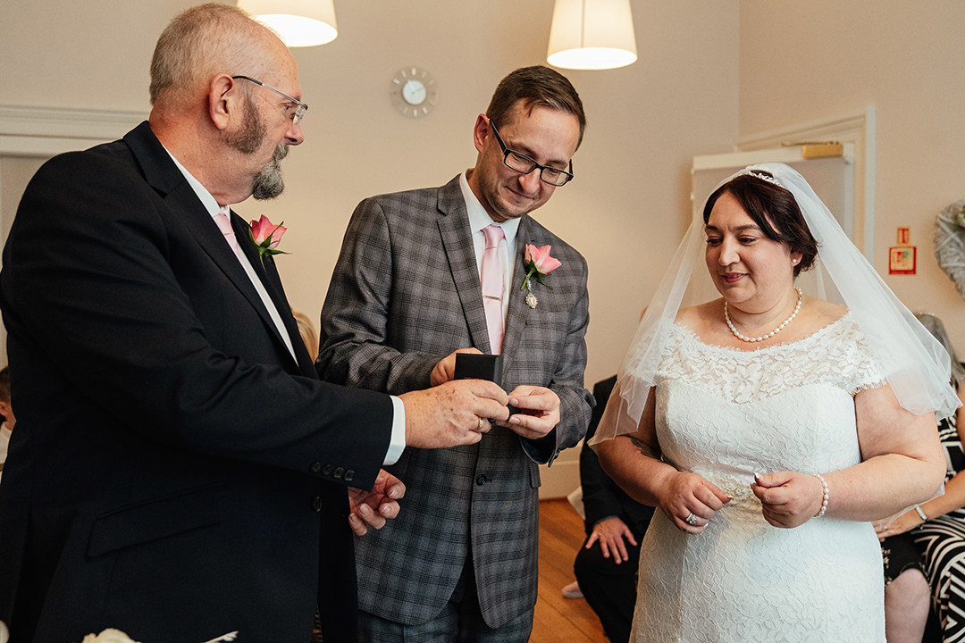 Best man give bride ring at Moot House Wedding Ceremony