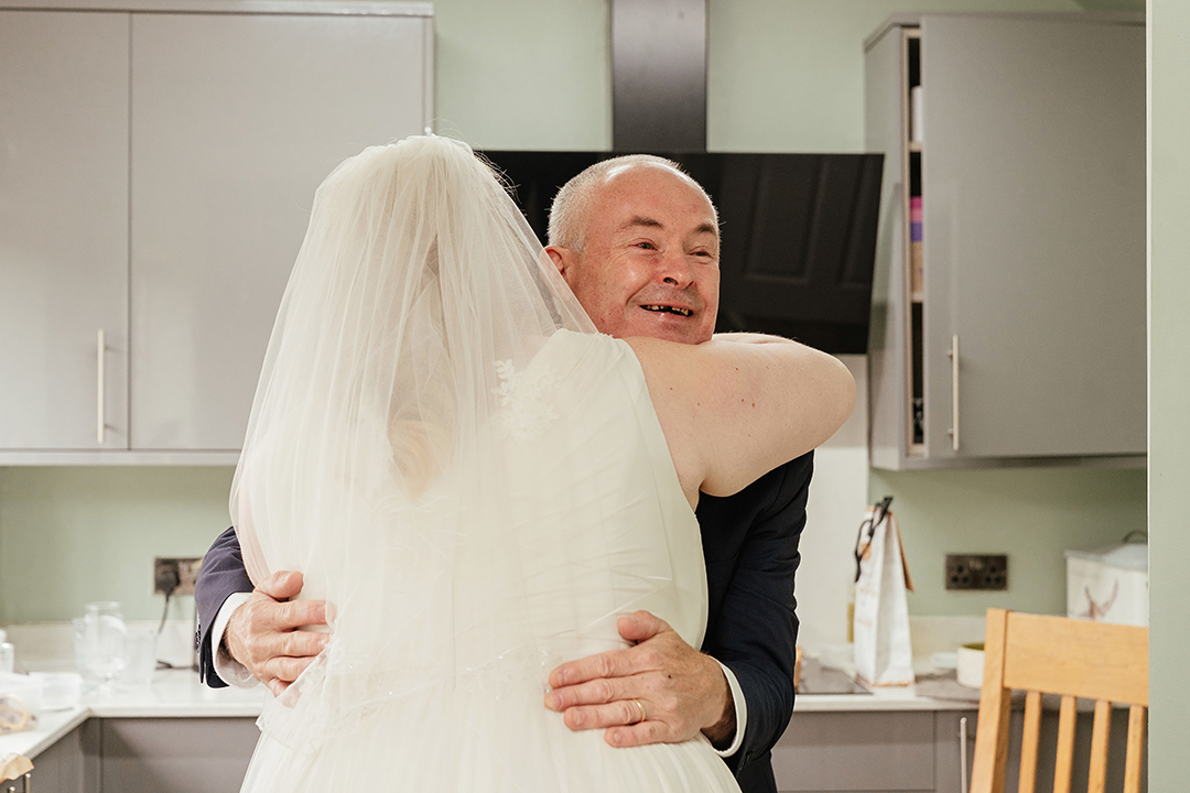 Bride and Dad Embrace