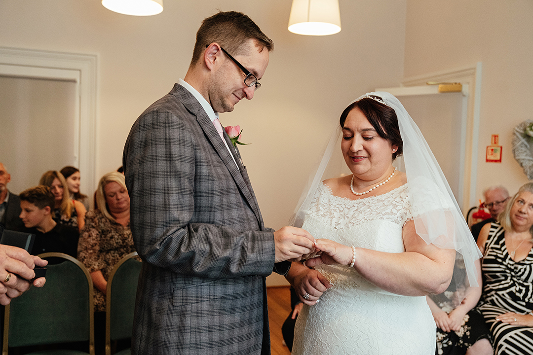 Couple exchange rings at Moot House Wedding ceremony