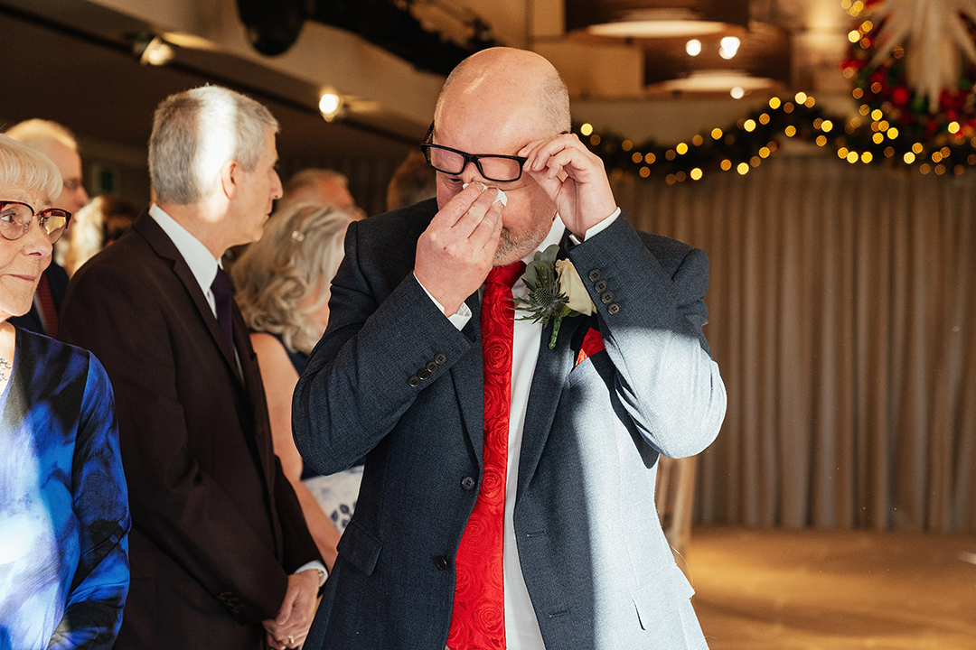 Wipes Eyes with tissue Waiting for Bride The Lion House Wedding Photography