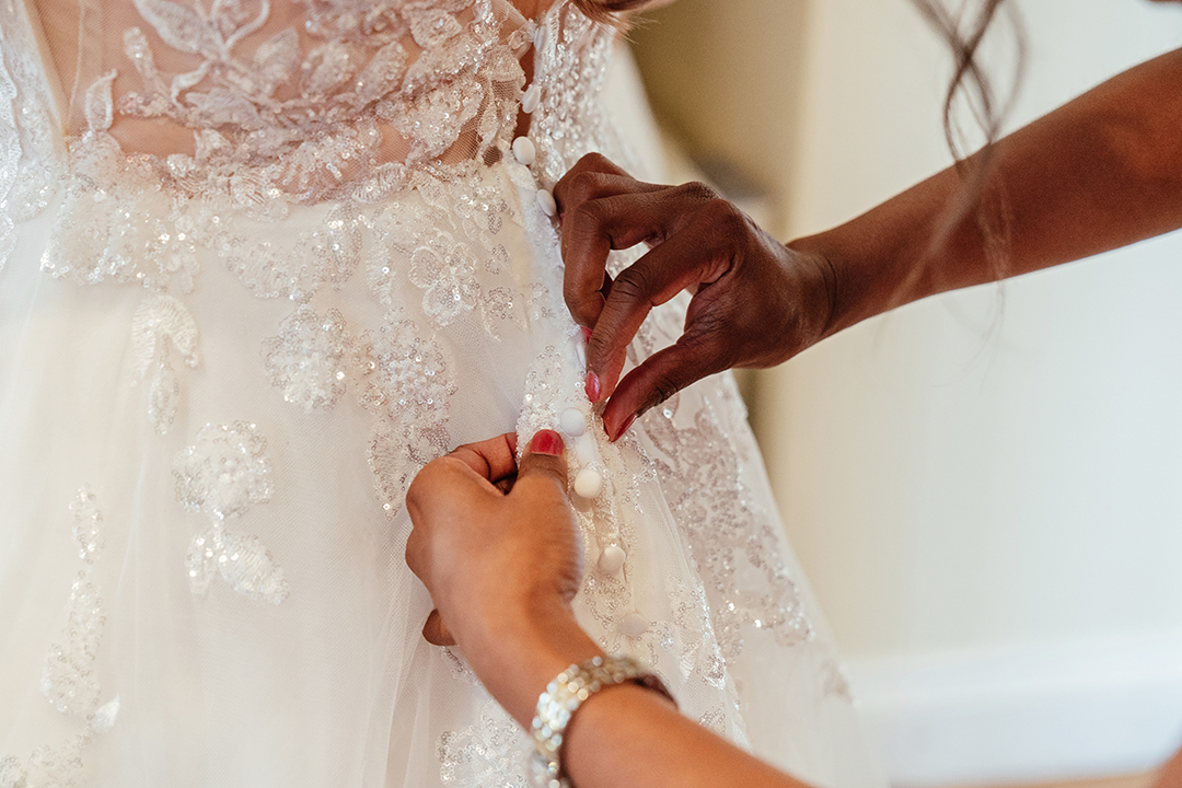 Close up of Buttoning Wedding Dress Vaulty Manor Wedding Photography