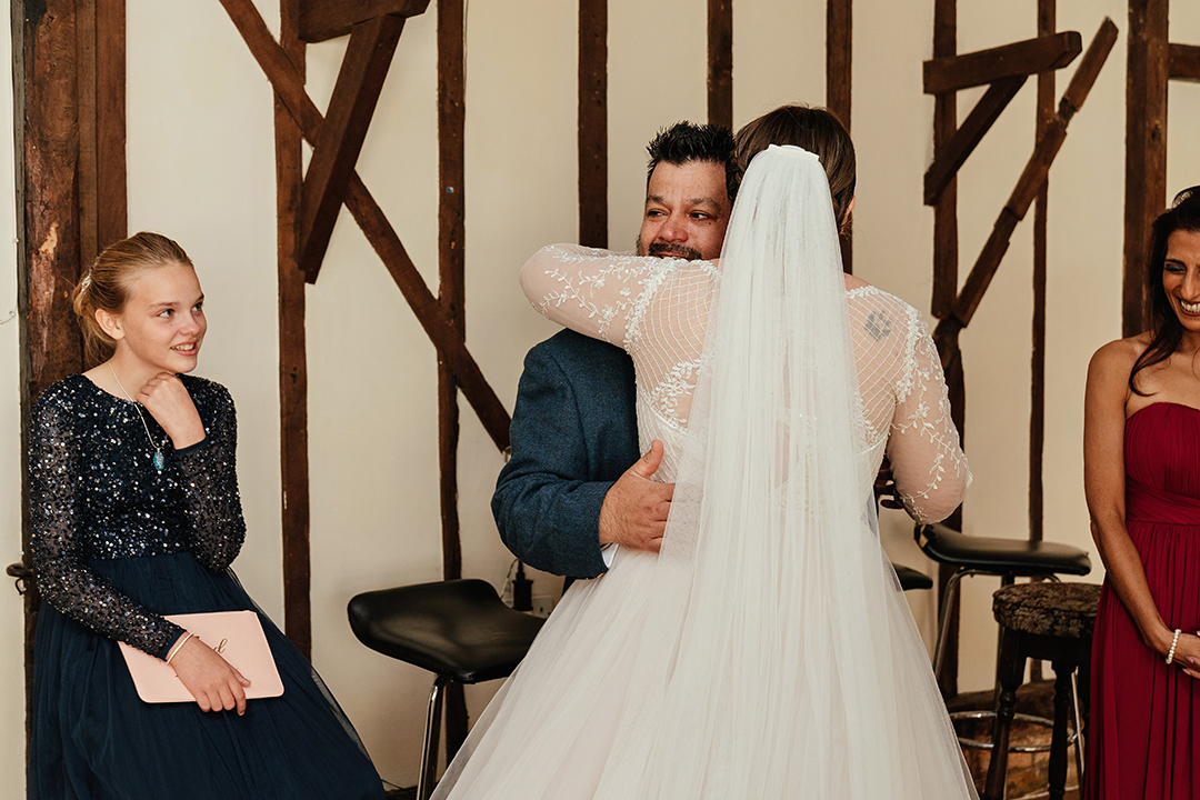 FOB and bride hug in emotional first look Minstrel Court Wedding Photography