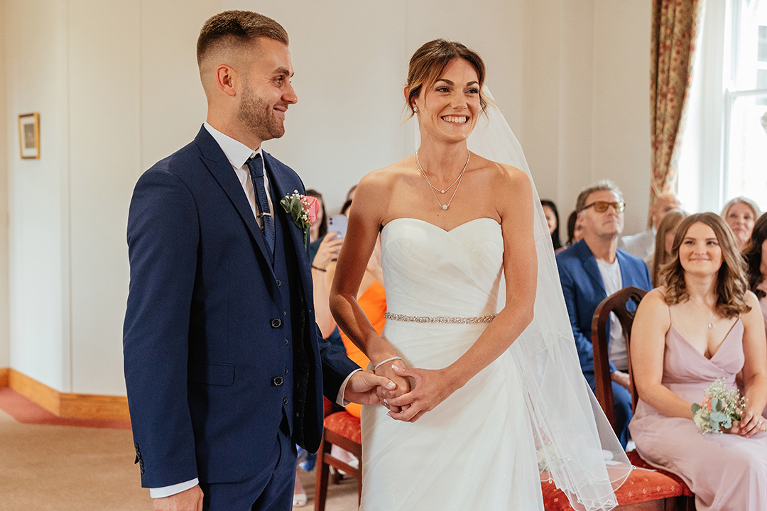 Bride and Groom Smiling During St Albans Registry Office Wedding Ceremony