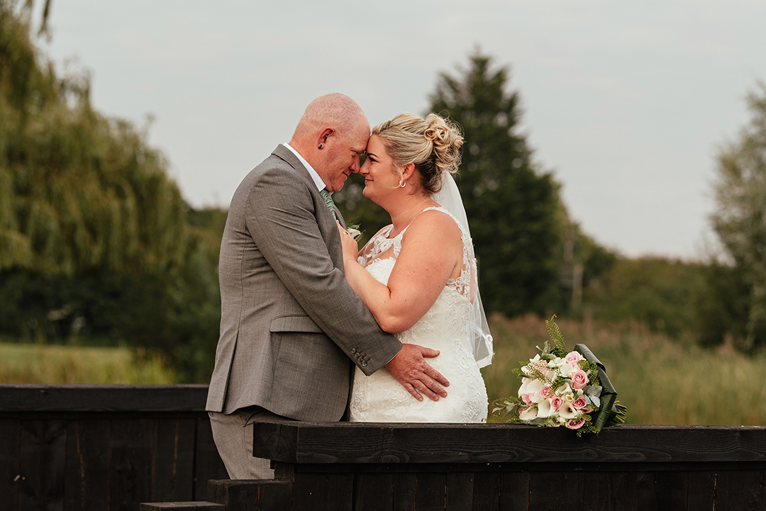 Couple Embrace Heads Together In Intimate, Natural Couples Shot The Rayleigh Club Wedding Photography