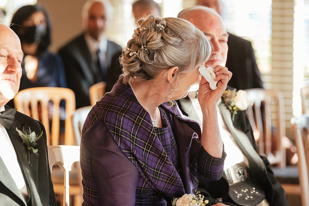 Emotional Mother of the Bride Wipes Eyes with Tissue The Lion House Wedding Ceremony