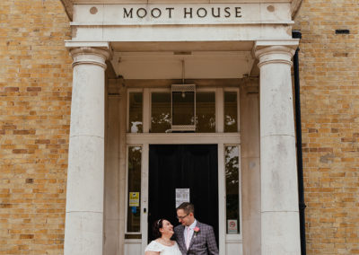 Couple stand outside the Moot House Harlow Building