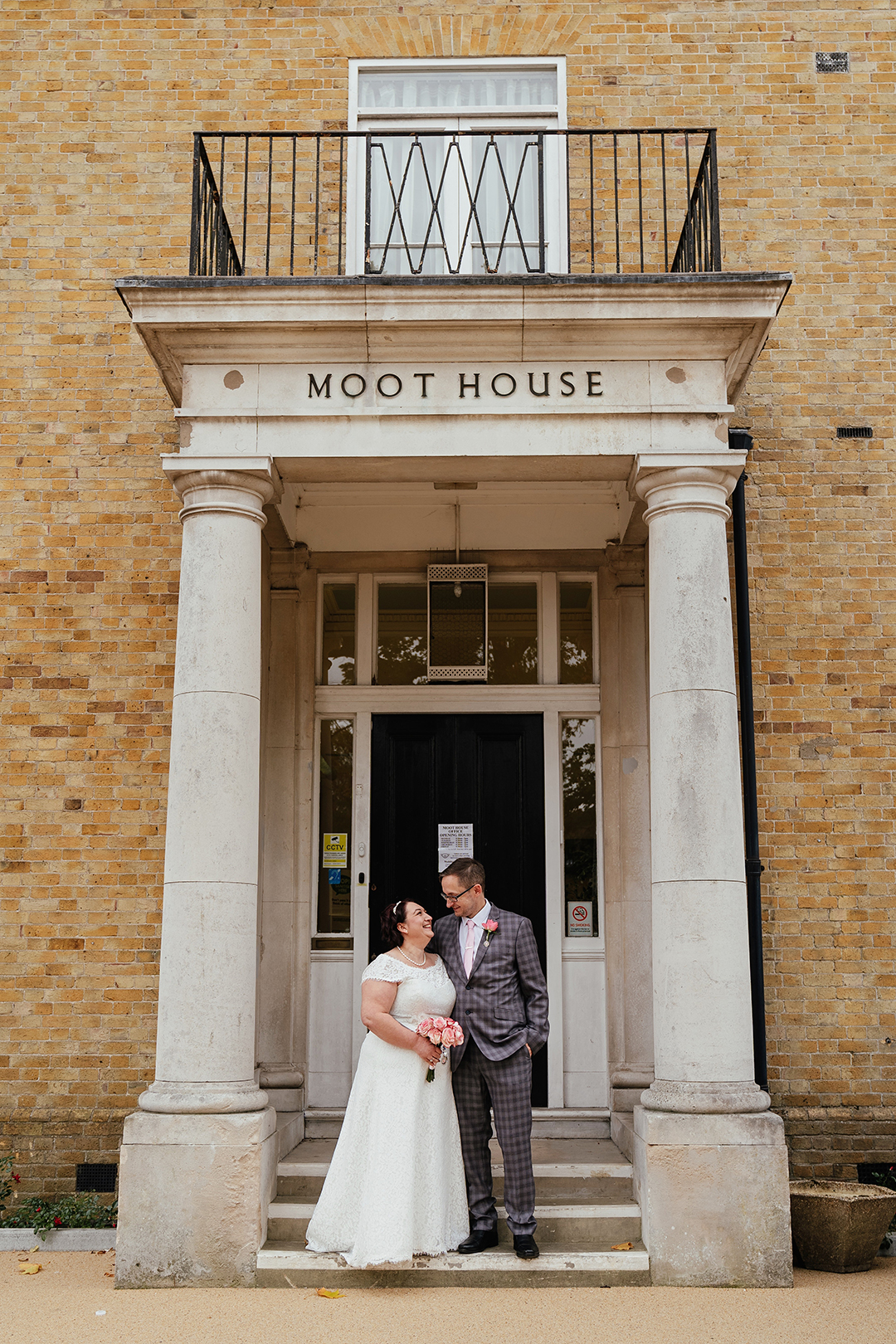 Couple stand outside the Moot House Harlow Building