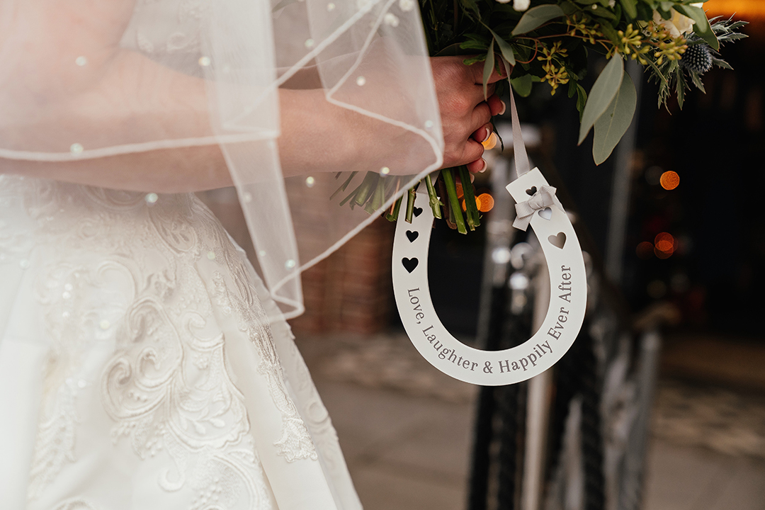 Lucky Horseshoe That Reads "Love, Laughter and Happily Ever After" The Lion House Wedding Ceremony