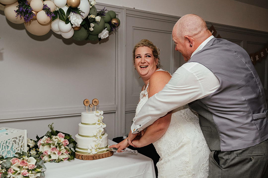 Laughing Cutting the Cake The Rayleigh Club Wedding Photography