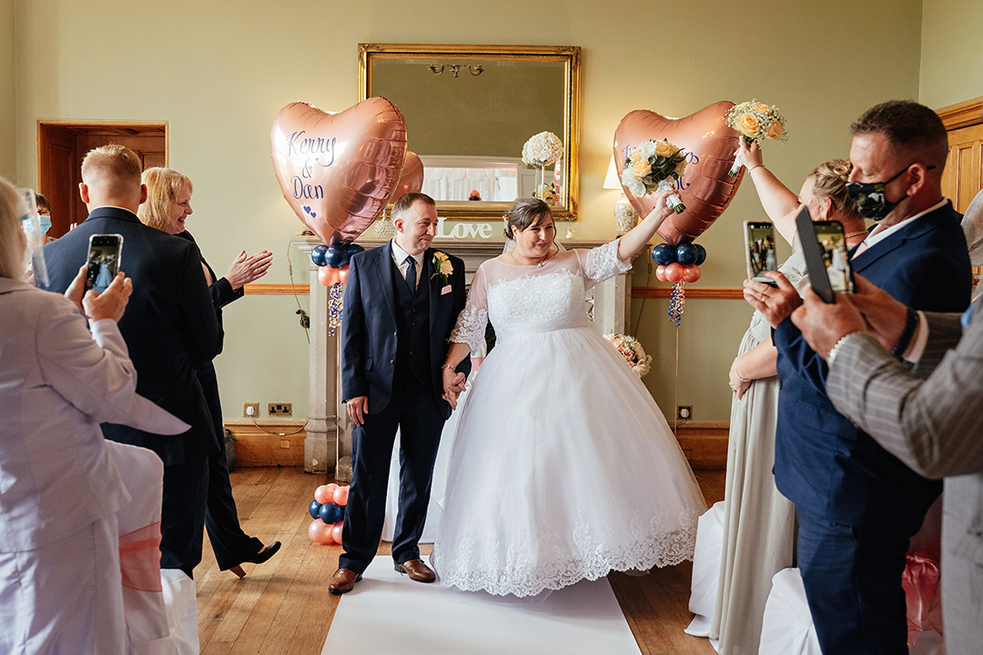 Hertfordshire Golf & Country Club Wedding Just Married Couple Celebrate Holding arms in the air