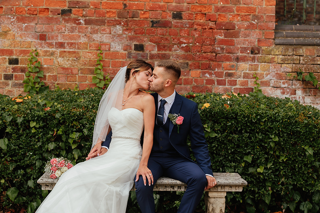 Couples Photos Kiss on Bench St Albans Registry Office Wedding Photography