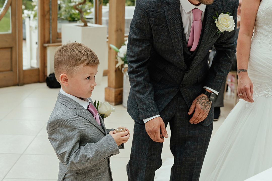 Close Up Son Gives Rings Gaynes Park Wedding Ceremony
