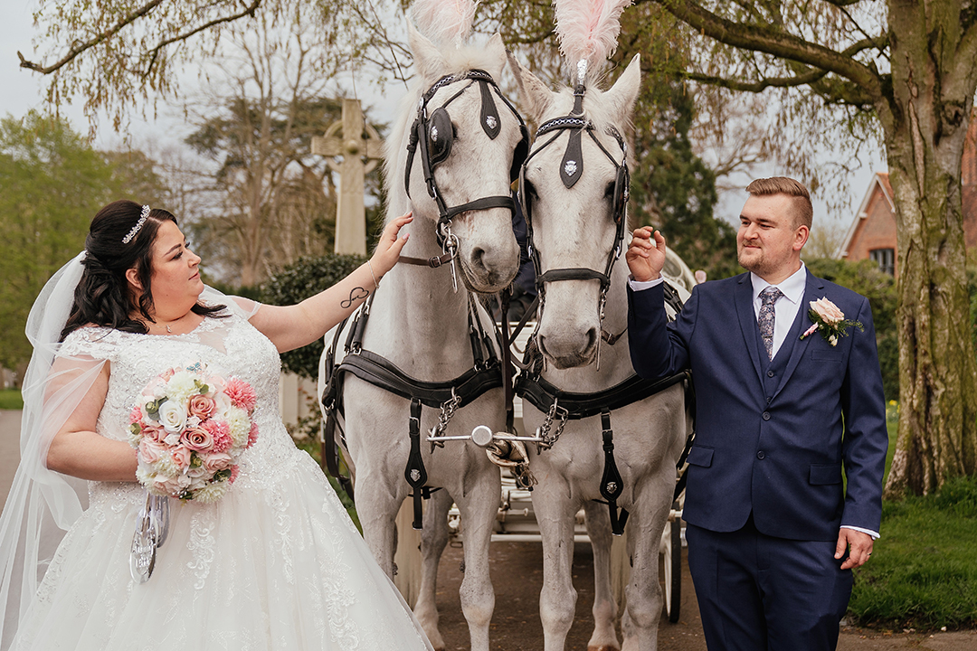 Couple Stroke the Ostlers Horses