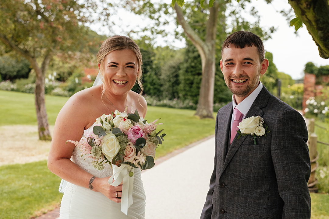 Couple Smile at Guests Gaynes Park