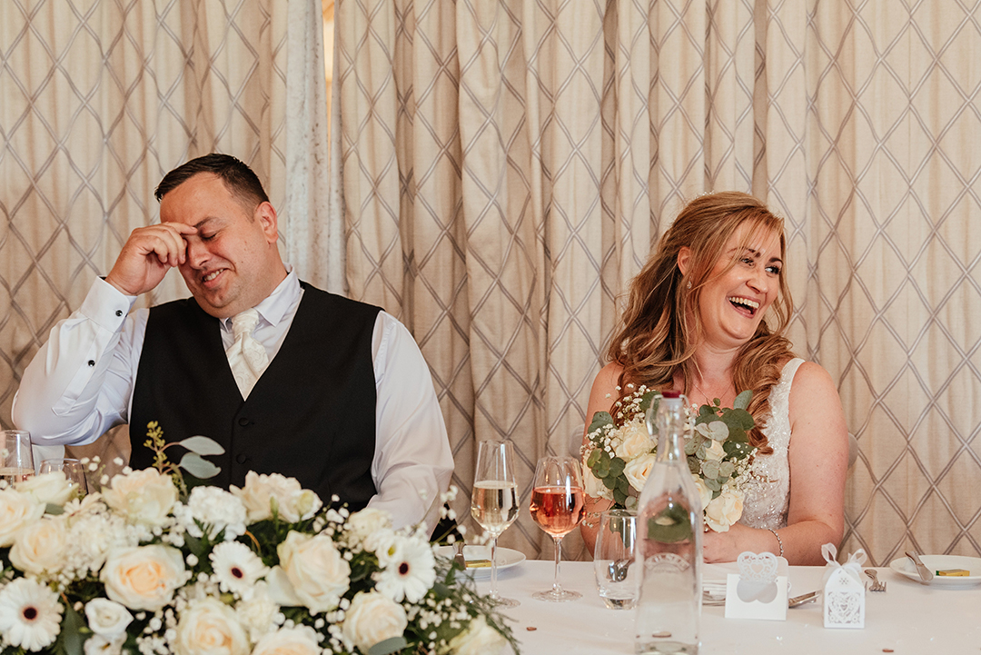 Couple Laugh During Speeches at Vaulty Manor Wedding
