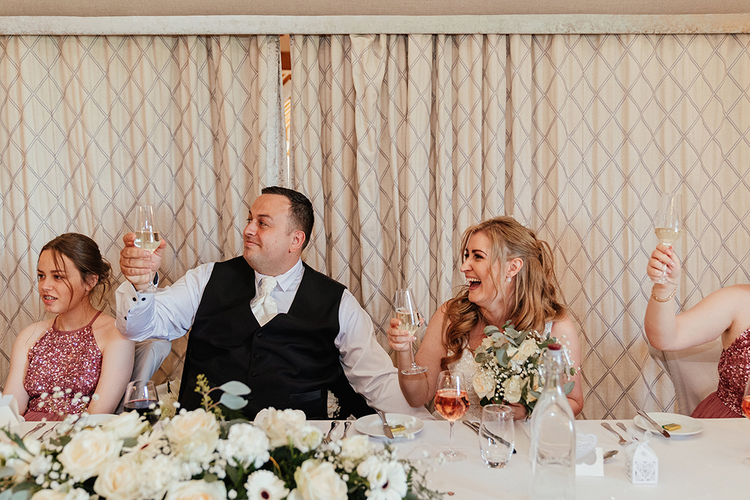 Couple Laughing Toast Speeches at Vaulty Manor Wedding