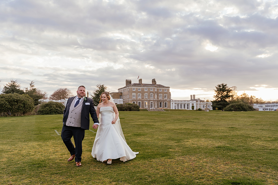 Woolverstone Hall Wedding Couple Photos Venue in Background Couple Walking