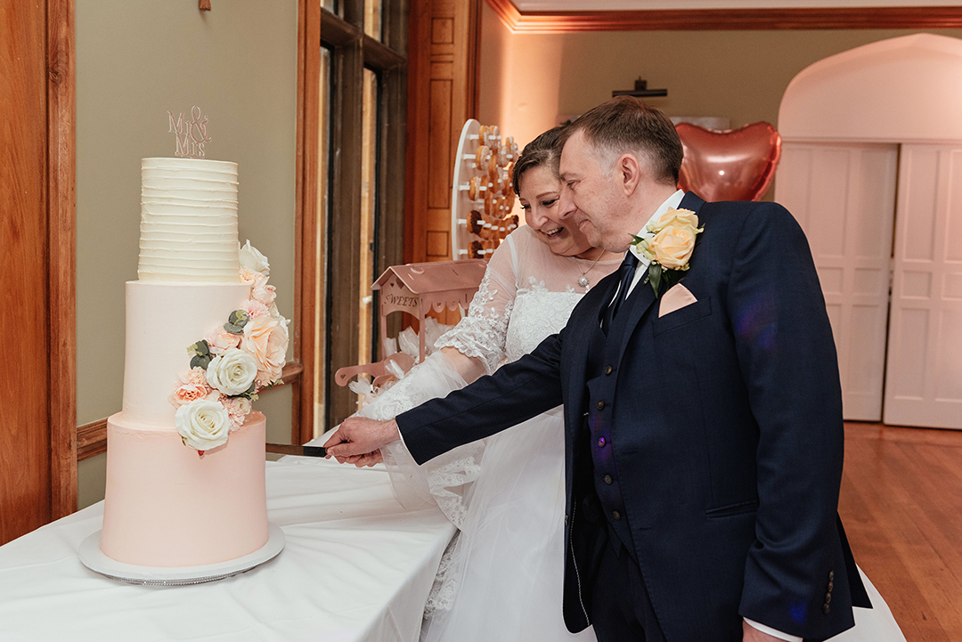Hertfordshire Golf & Country Club Wedding Cutting the Cake