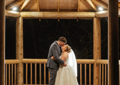 Bride and Groom Kiss under gazebo That Amazing Place Wedding Photography Night Time Couples Shot
