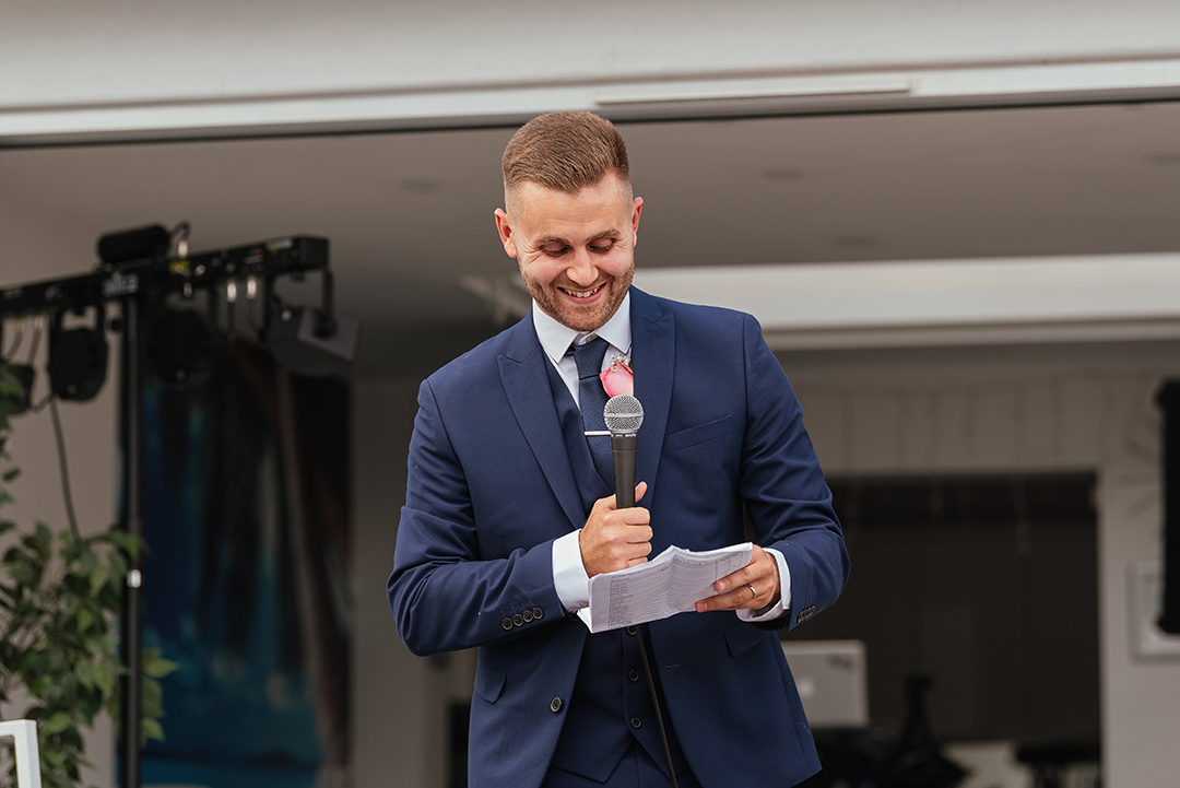 Groom Laughing During Speech Wedding Photography