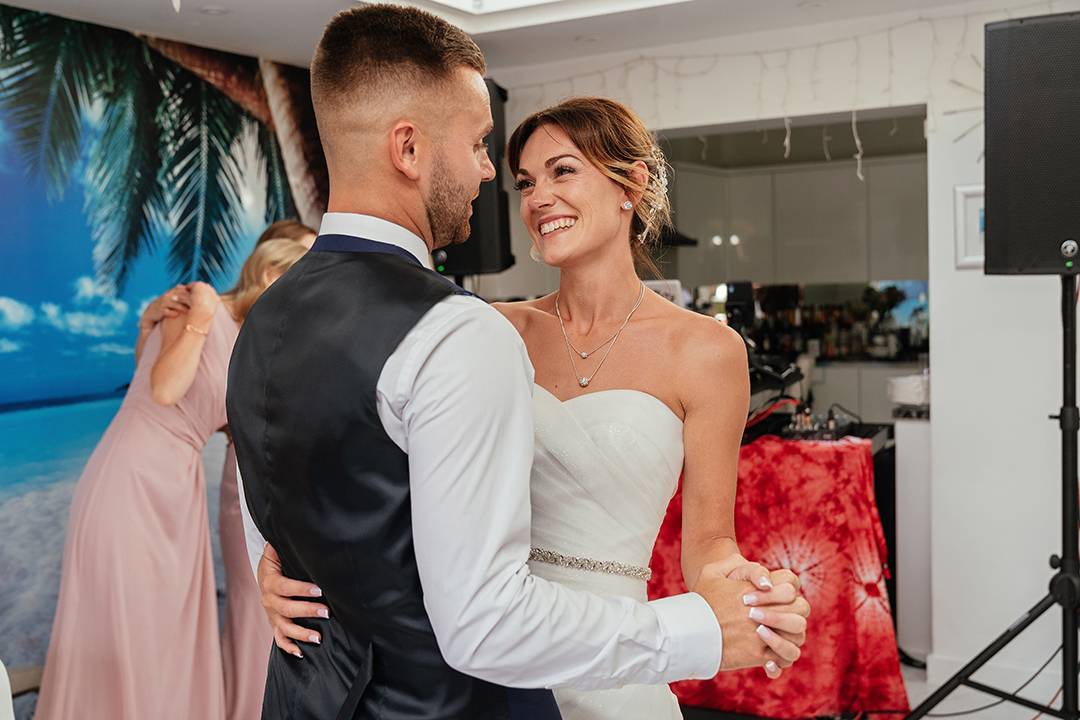 Couple Smile and Look to Each other During First Dance