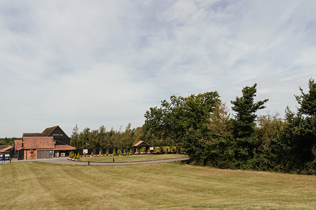 Crondon Parks Baronial Hall sitting in the frame surrounded by countryside views