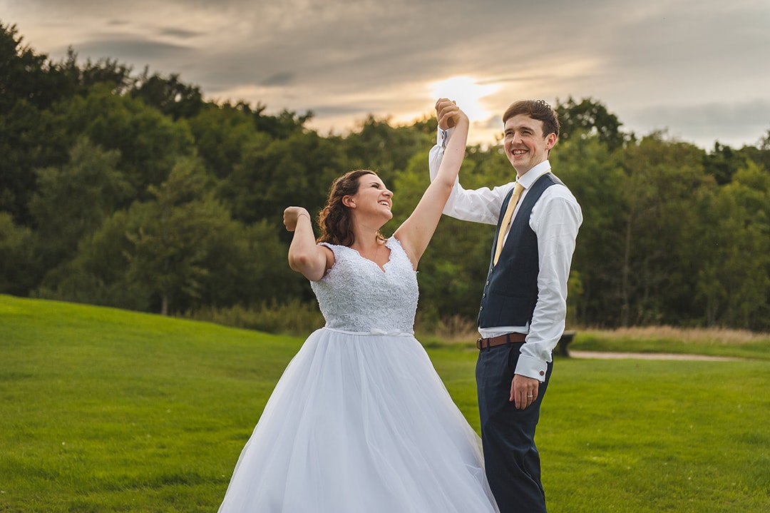 Bride and Groom celebrate in couples portraits at sunset