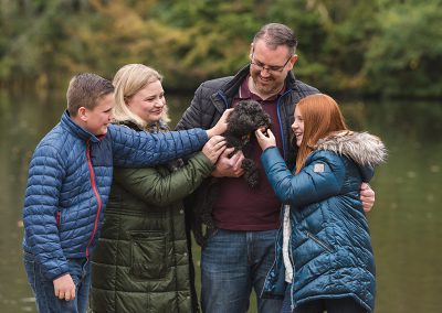 Close up of family fuss the dog in natural family photography