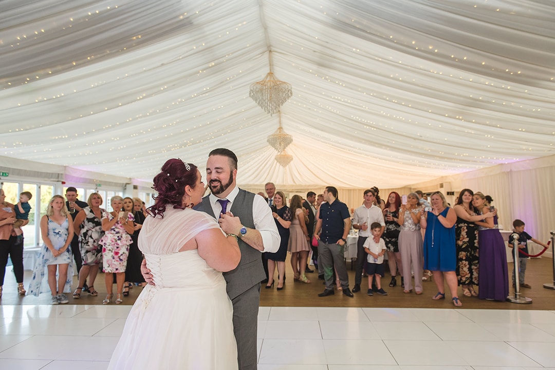 Wider shot of couple's first dance at Parklands Quendon Hall
