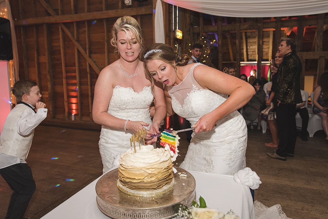 Bride nearly drops rainbow slice of wedding cake!