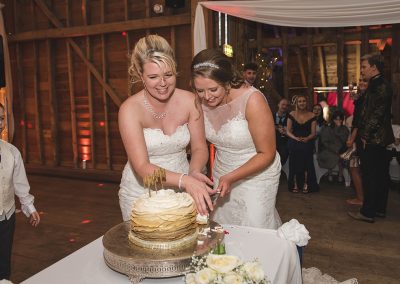 Brides try to save the dropped piece of cake!