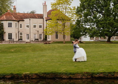 Groom Lifts Bride Couples Photos by the Lake That Amazing Place