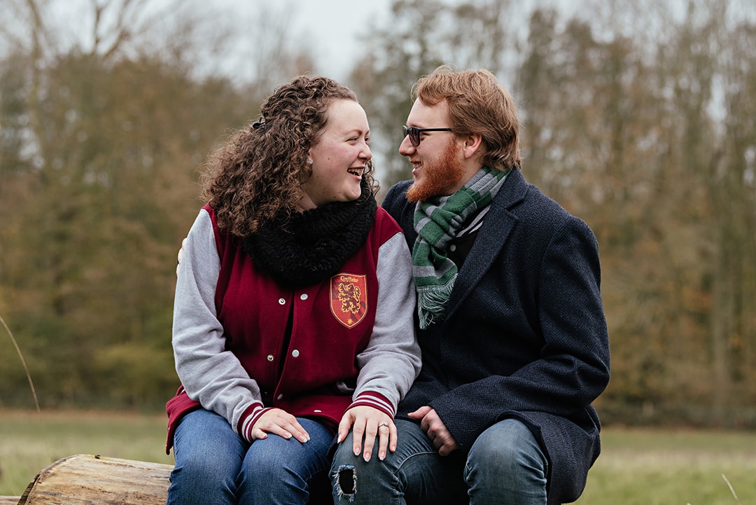 Unposed engagement photography where couple look to each other