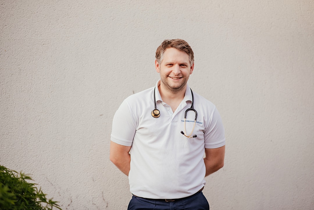 Closer Portrait of ITU Physiotherapist, Ben in Uniform with Stethoscope