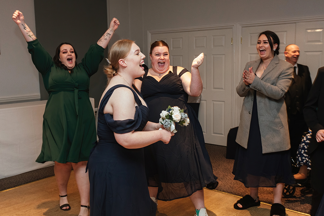 Storytelling wedding photography bridemaids and guest after bouquet throw