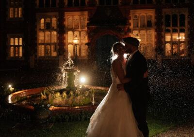 Beautiful night shot in front of fountain as Gosfield Hall