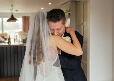 Dad Crying and Hugging Bride