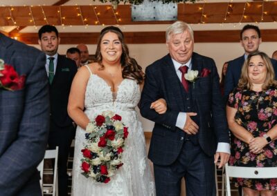 Dad walks bride down aisle barn wedding